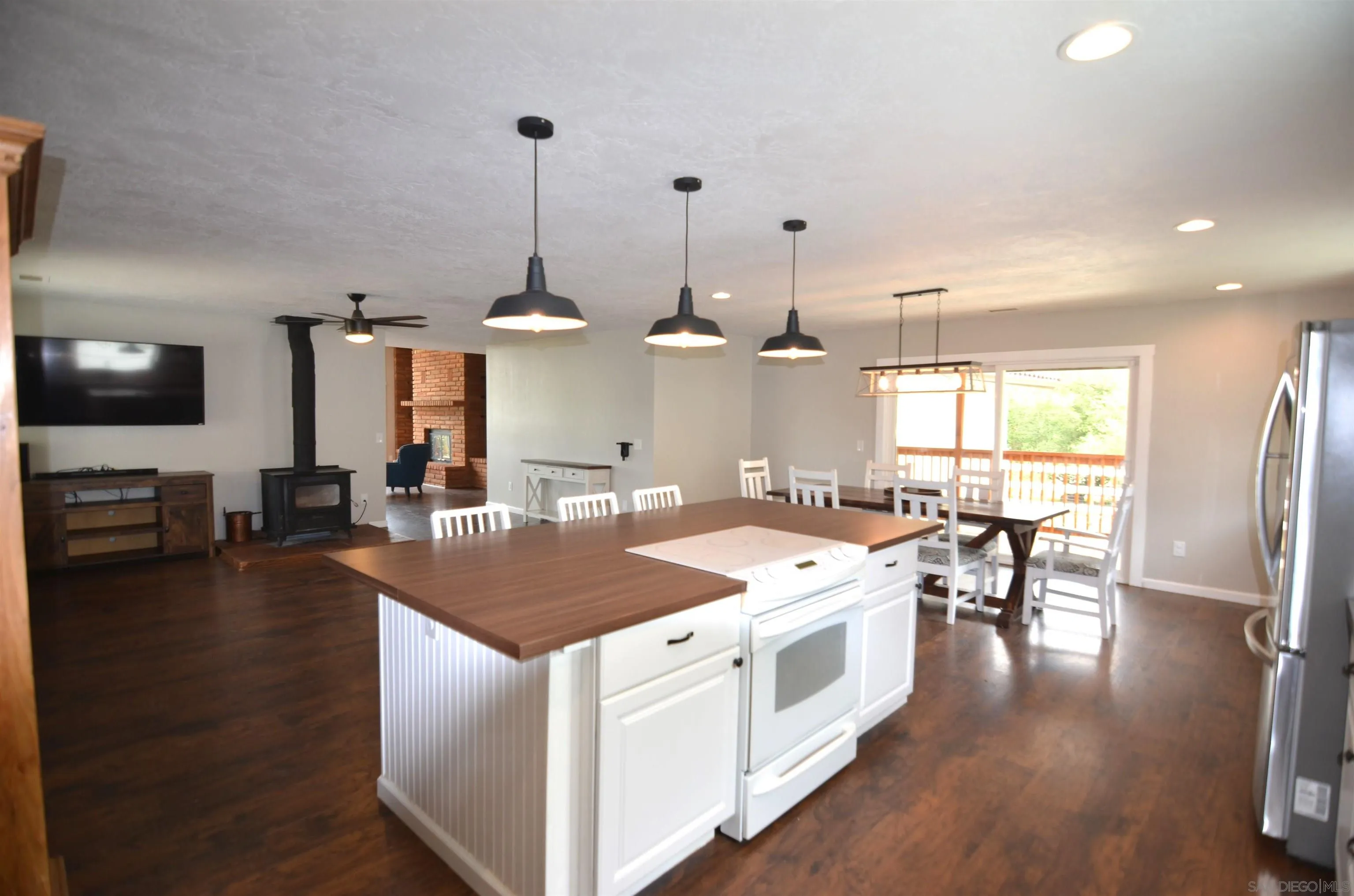 30643 Rabbit Run Valley Center, CA 92082 - Photo 8 of 59 a kitchen that has a lot of cabinets and wooden floor