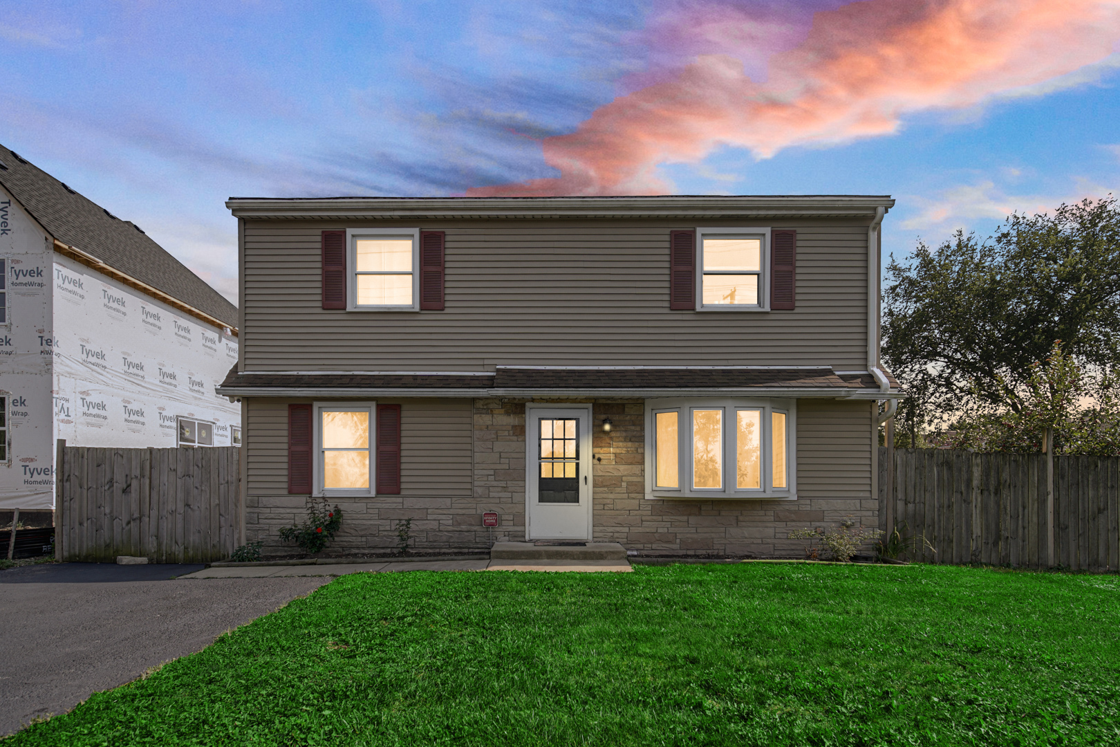 a front view of a house with a yard