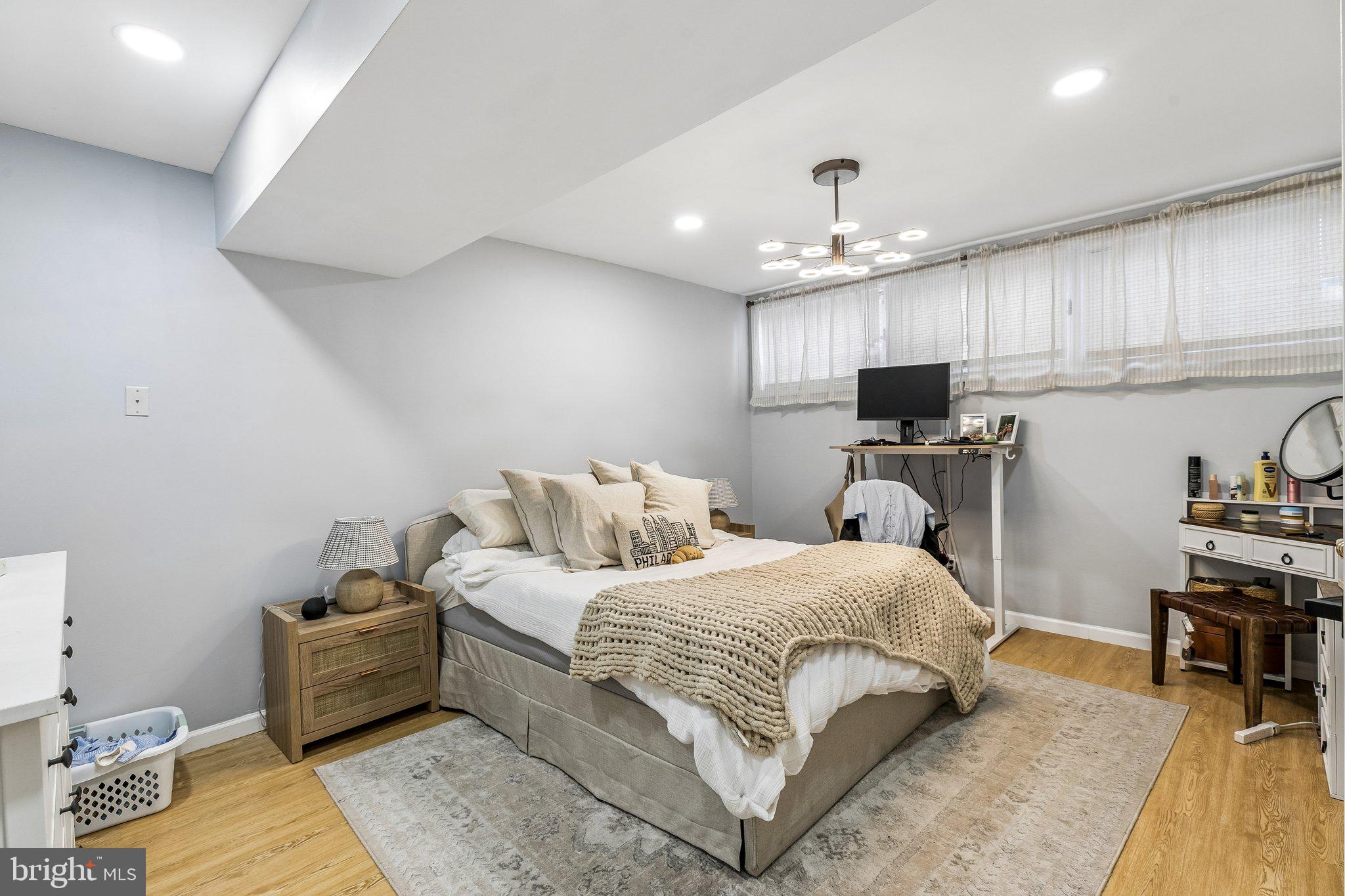 1130 Lombard Street Philadelphia, PA 19147 - Photo 35 of 45 a bedroom with a bed wooden floor and furniture