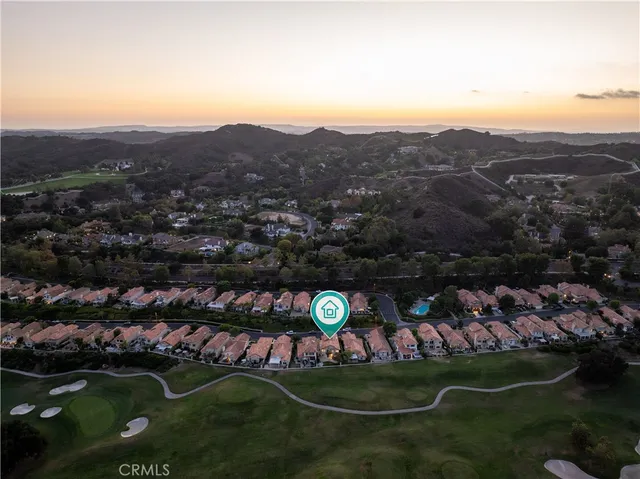 an aerial view of a house with a garden