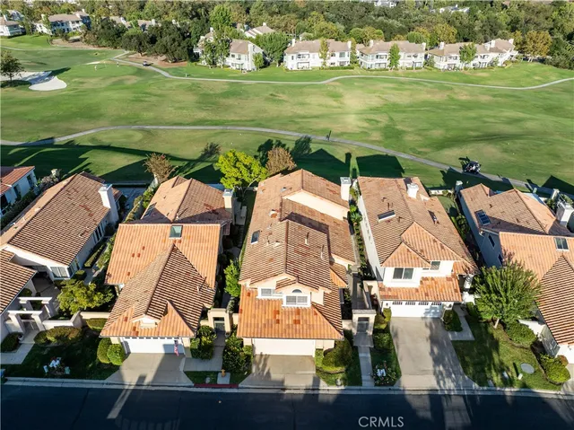 an aerial view of a house with a ocean view