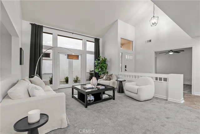 a living room with furniture and a large window