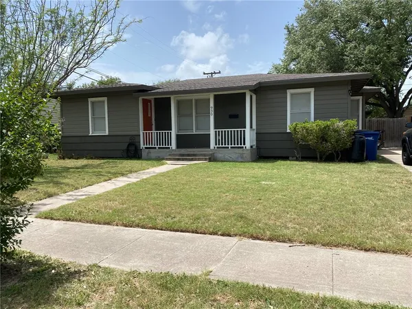 a view of a house with backyard sitting area and garden