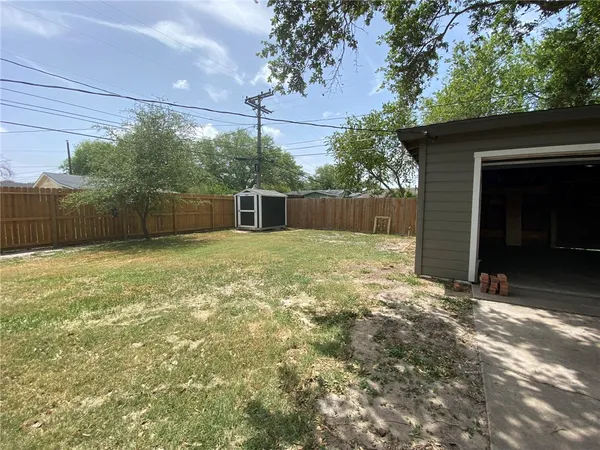 a view of a backyard of the house