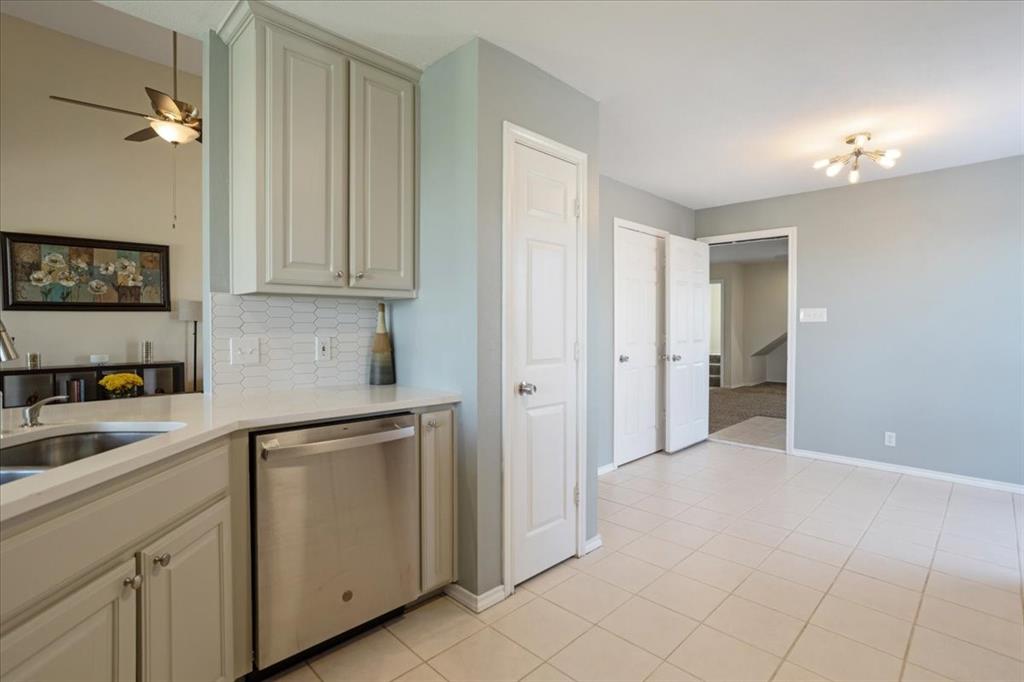 336 Old Highway 6 Howe, TX 75459 - Photo 10 of 40 a kitchen with white cabinets and a sink