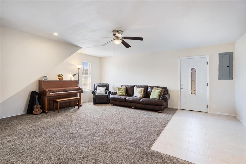 336 Old Highway 6 Howe, TX 75459 - Photo 12 of 40 a living room with furniture and a ceiling fan