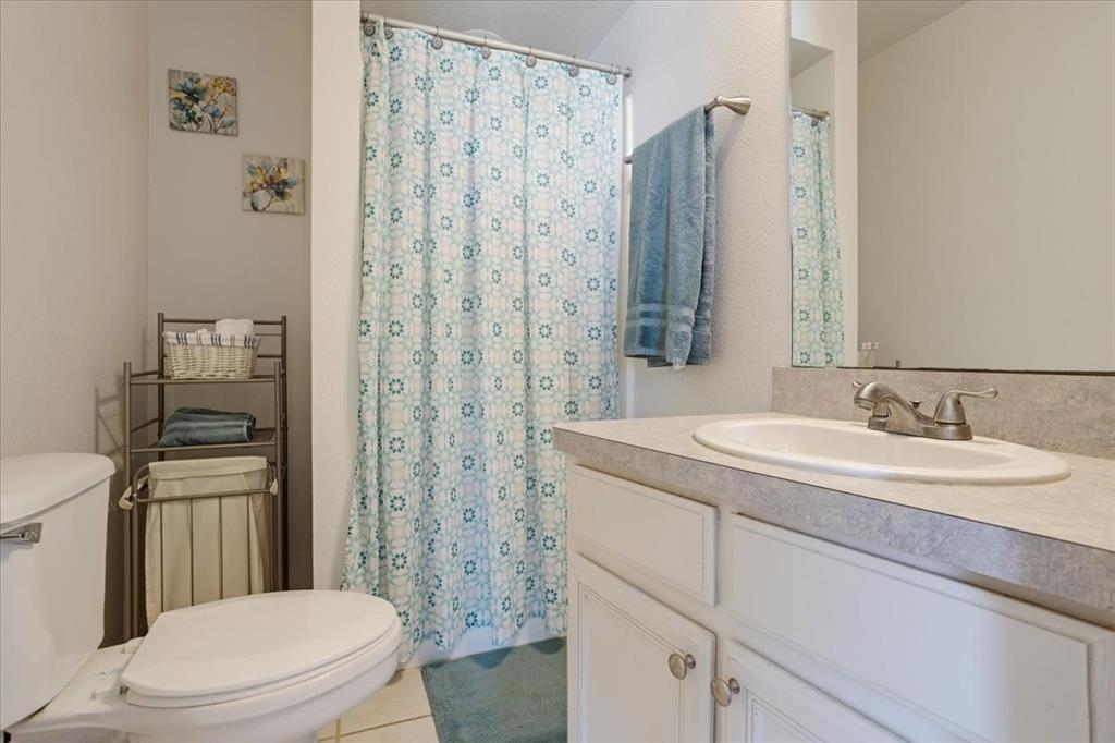 336 Old Highway 6 Howe, TX 75459 - Photo 23 of 40 a bathroom with a granite countertop sink toilet and shower