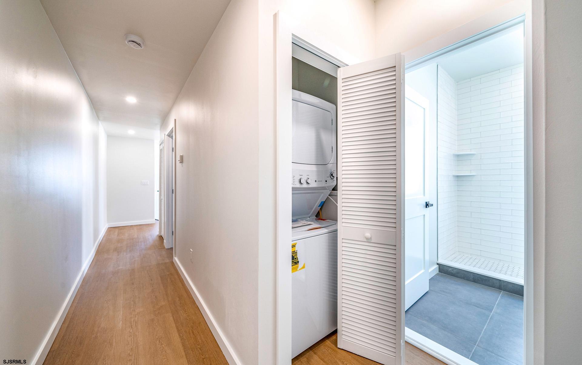 713 East 8th Street, Unit B Ocean City, NJ 08226 - Photo 12 of 25 a view of hallway with stairs and wooden floor