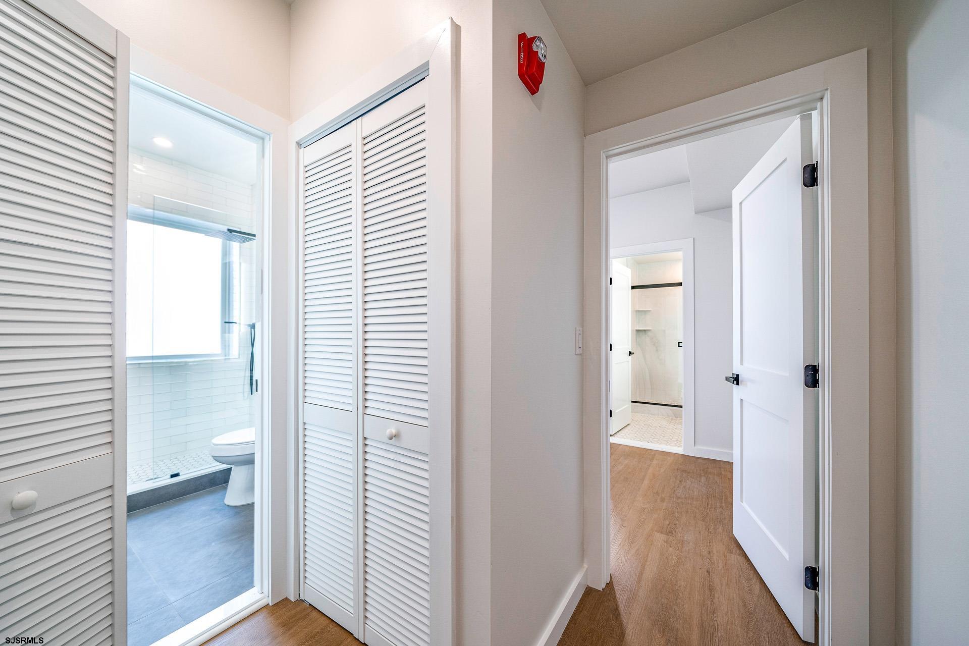 713 East 8th Street, Unit B Ocean City, NJ 08226 - Photo 13 of 25 a view of a bathroom from a hallway