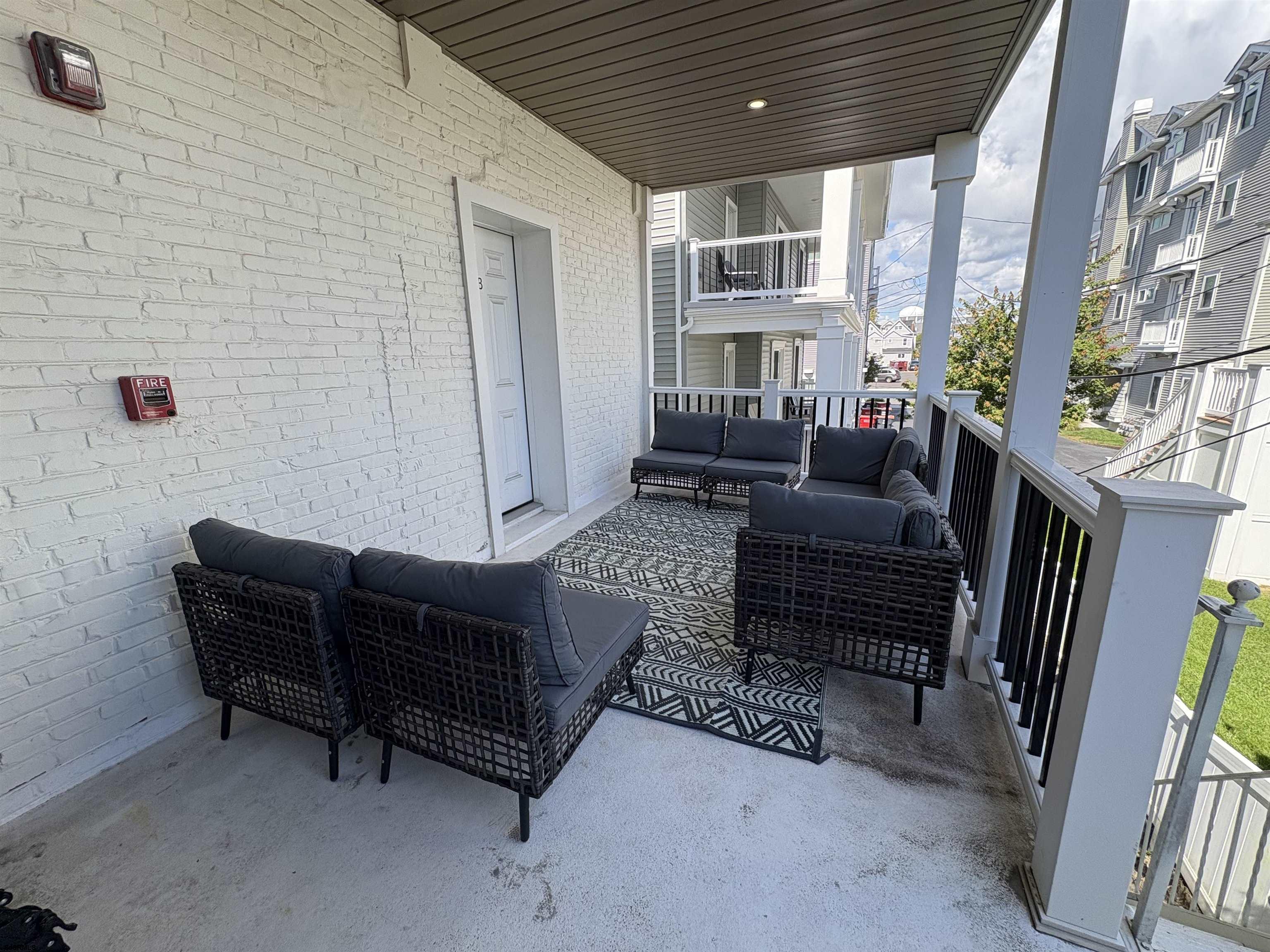 713 East 8th Street, Unit B Ocean City, NJ 08226 - Photo 18 of 25 a living room with furniture and a large window