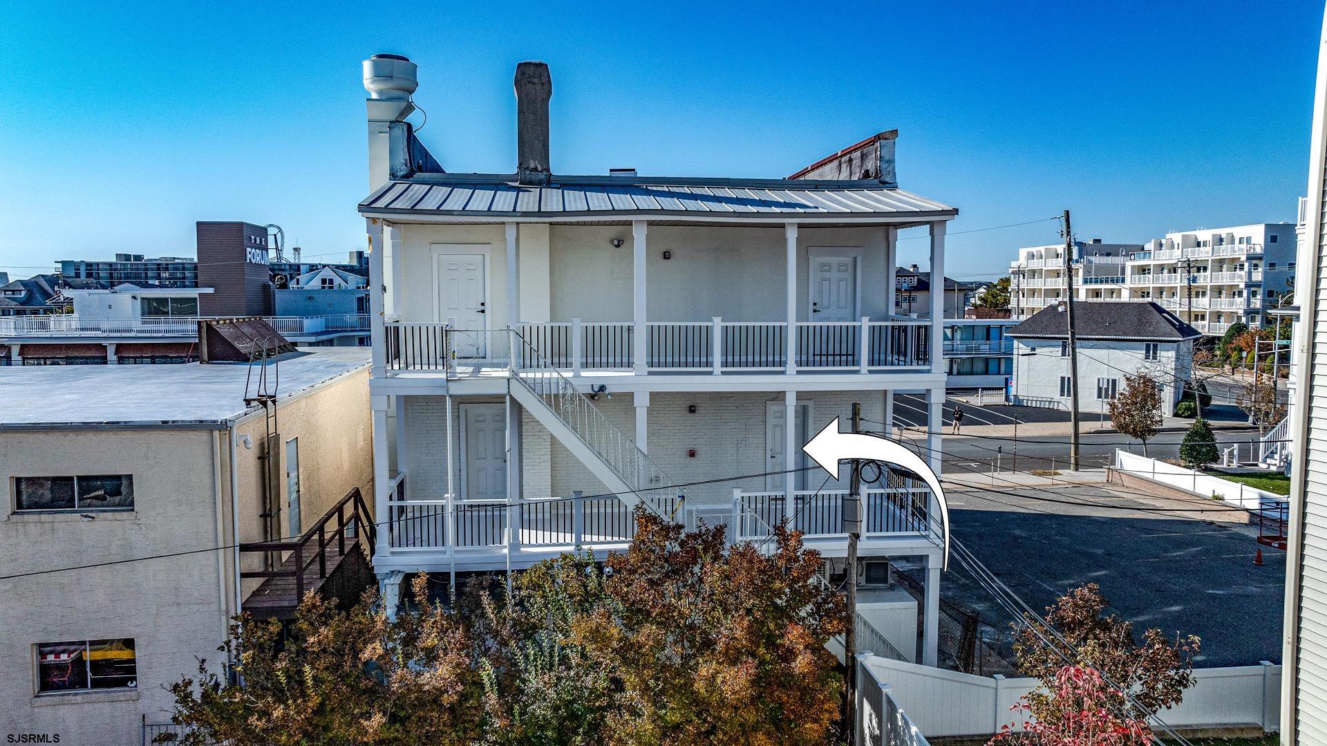 713 East 8th Street, Unit B Ocean City, NJ 08226 - Photo 20 of 25 a front view of a house with a garden