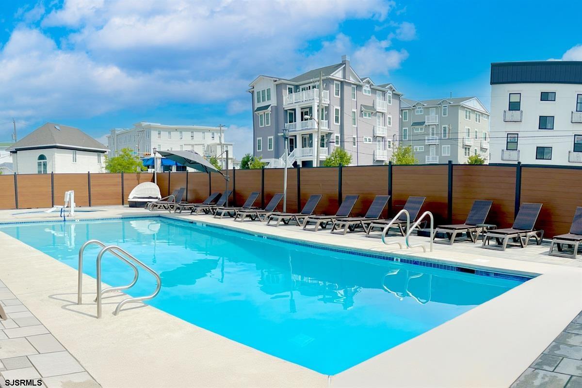 713 East 8th Street, Unit B Ocean City, NJ 08226 - Photo 2 of 25 a view of swimming pool with outdoor seating