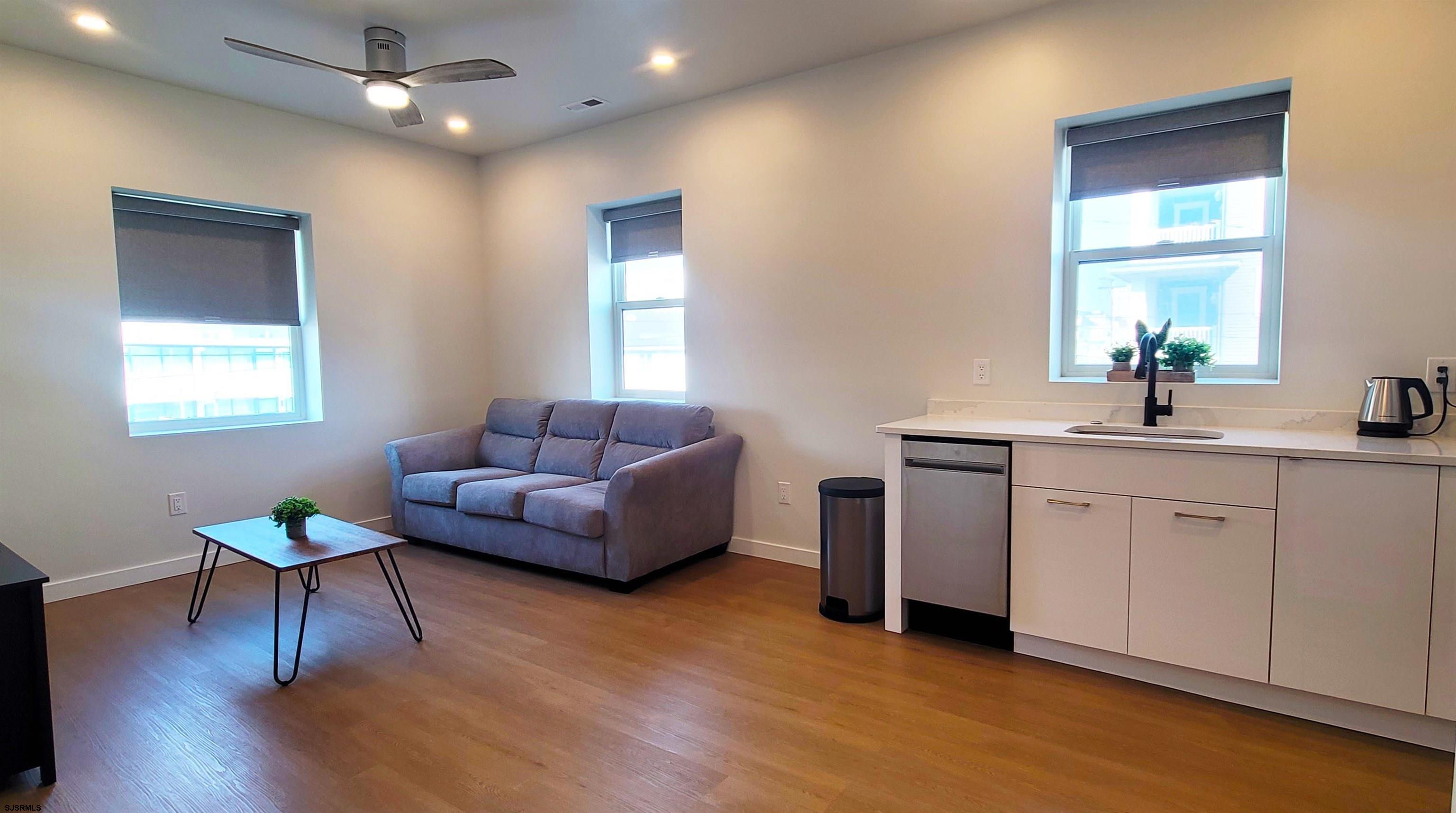 713 East 8th Street, Unit B Ocean City, NJ 08226 - Photo 7 of 25 a living room with furniture and a wooden floor