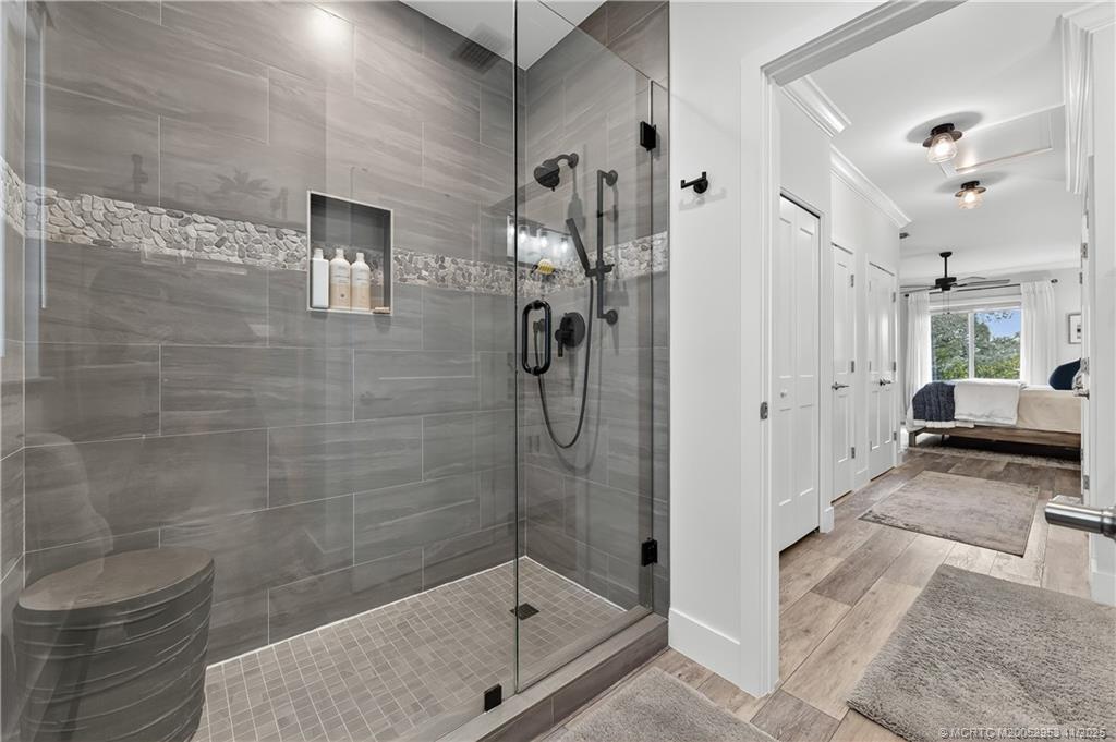 12463 Harbour Ridge Boulevard, Unit 26 Palm City, FL 34990 - Photo 18 of 34 a bathroom with a shower