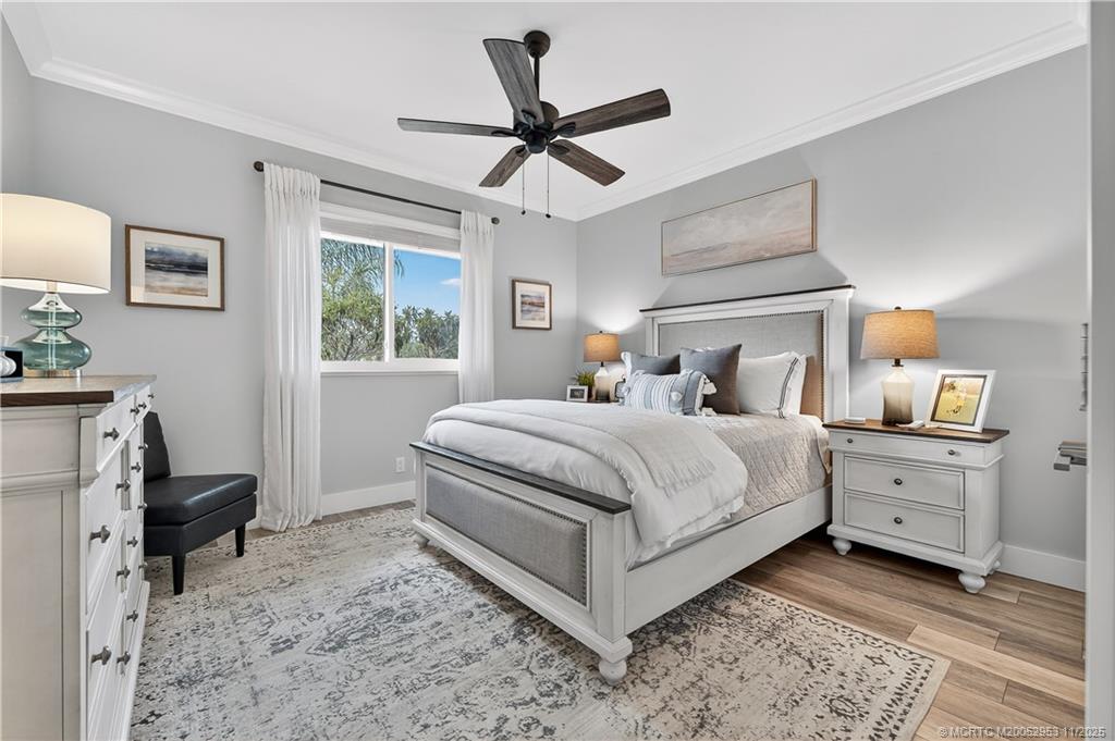 12463 Harbour Ridge Boulevard, Unit 26 Palm City, FL 34990 - Photo 20 of 34 a bed room with a bed and a window