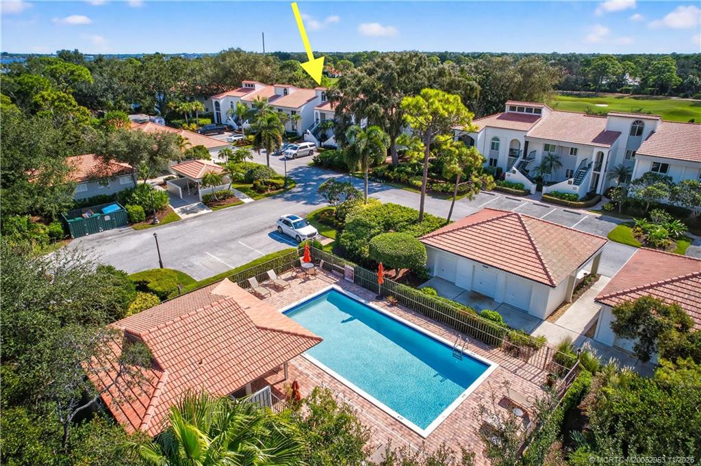 12463 Harbour Ridge Boulevard, Unit 26 Palm City, FL 34990 - Photo 25 of 34 an aerial view of a house with a garden and lake view