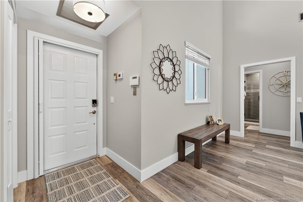 12463 Harbour Ridge Boulevard, Unit 26 Palm City, FL 34990 - Photo 3 of 34 a view of room with window and wooden floor