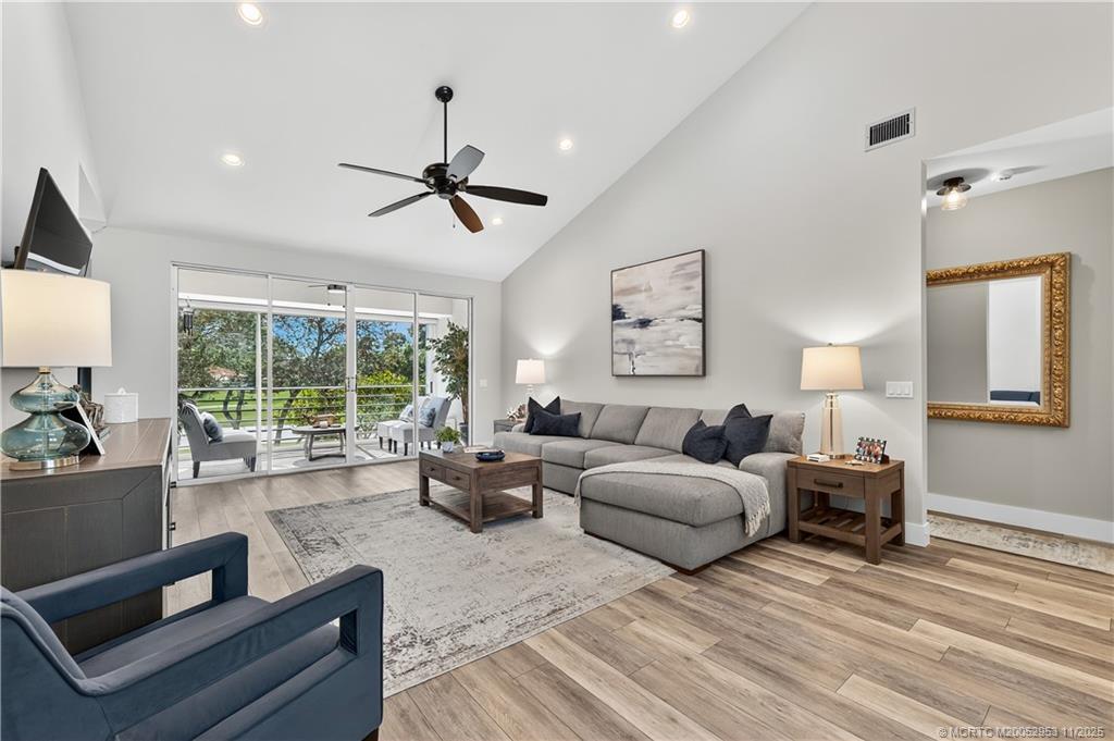 12463 Harbour Ridge Boulevard, Unit 26 Palm City, FL 34990 - Photo 4 of 34 a living room with furniture and a large window
