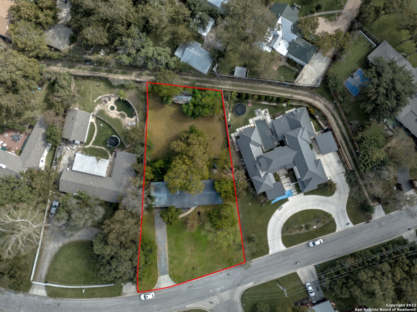 an aerial view of a house with outdoor space