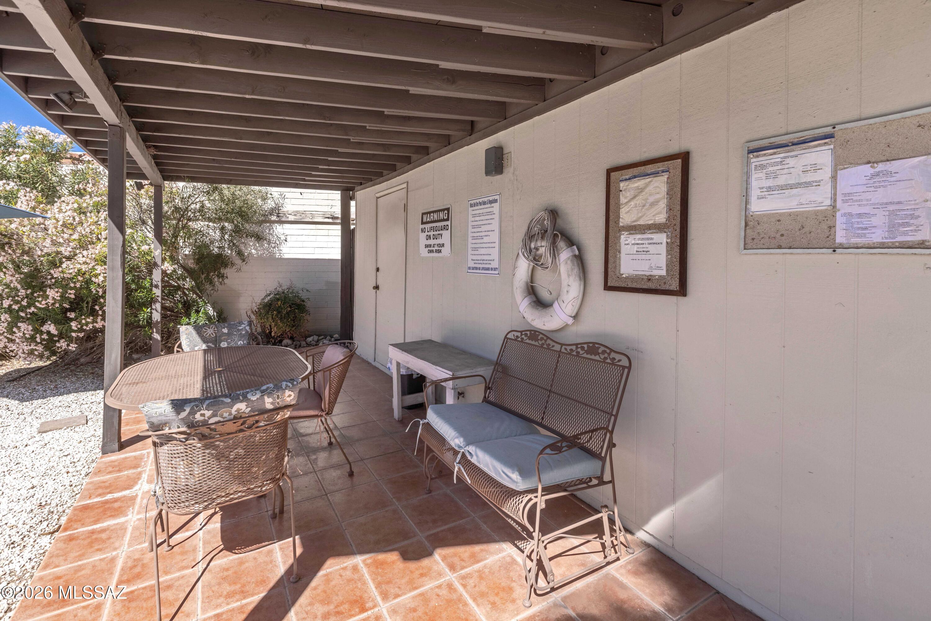 9111 North Oracle Road, Unit 110 Tucson, AZ 85704 - Photo 25 of 32 Shaded patio area next to pool.
