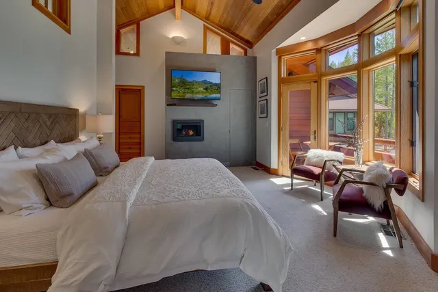 a bedroom with a bed and a fireplace