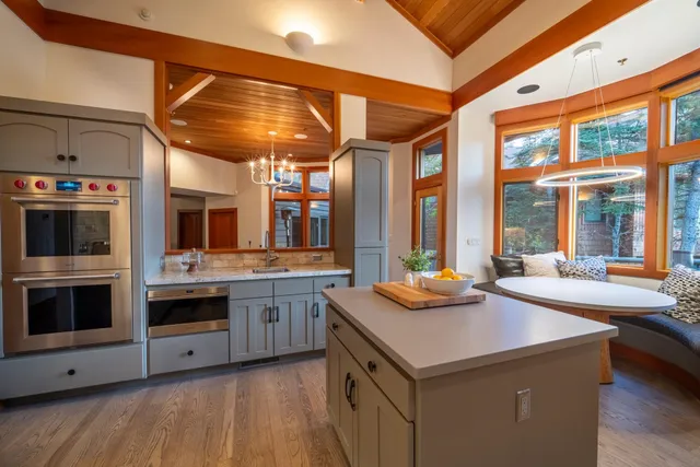 a kitchen with stainless steel appliances granite countertop a stove and a sink
