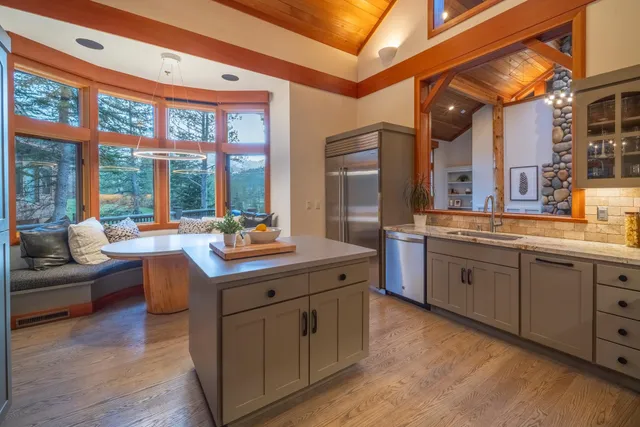 a kitchen with counter top space and living room