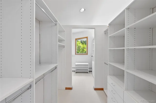 a view of an entryway with wooden floor and a sink