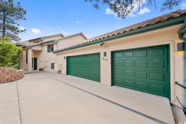 a front view of a house with a garage