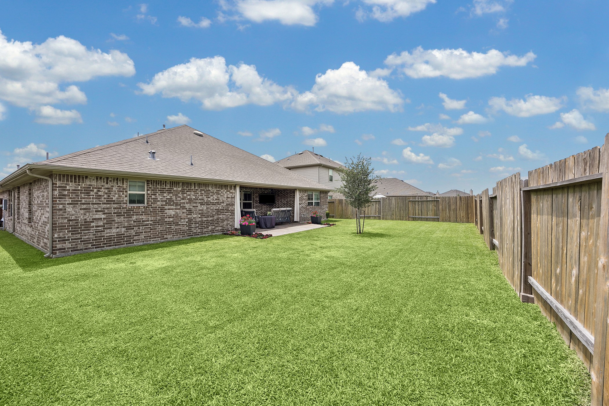 10227 Whitney Reach Drive Rosharon, TX 77583 - Photo 16 of 28 Nice open and fenced backyard with a paved extended patio.