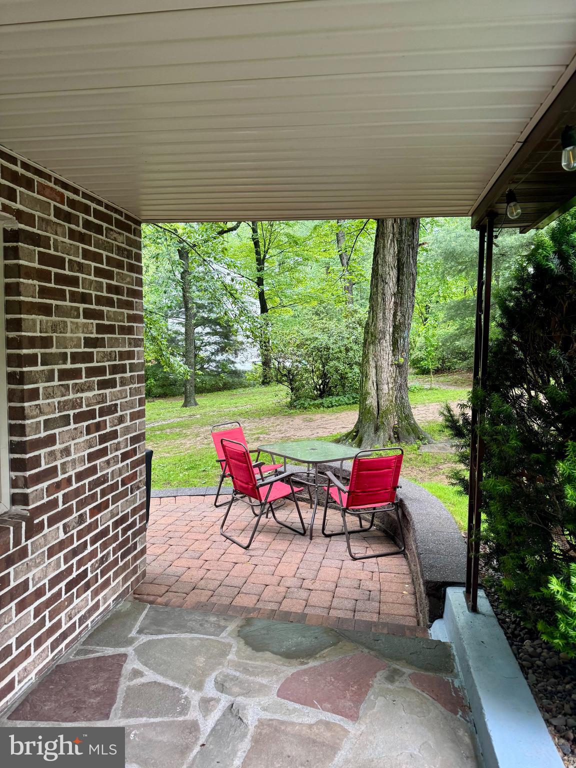 321 West 28th Division Highway Lititz, PA 17543 - Photo 7 of 15 an outdoor sitting area with couch and umbrella