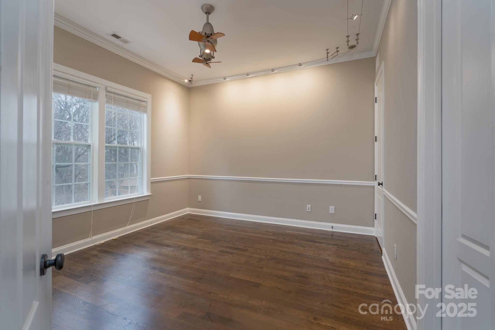 507 Quicksilver Trail Fort Mill, SC 29708 - Photo 16 of 48 an empty room with wooden floor and windows