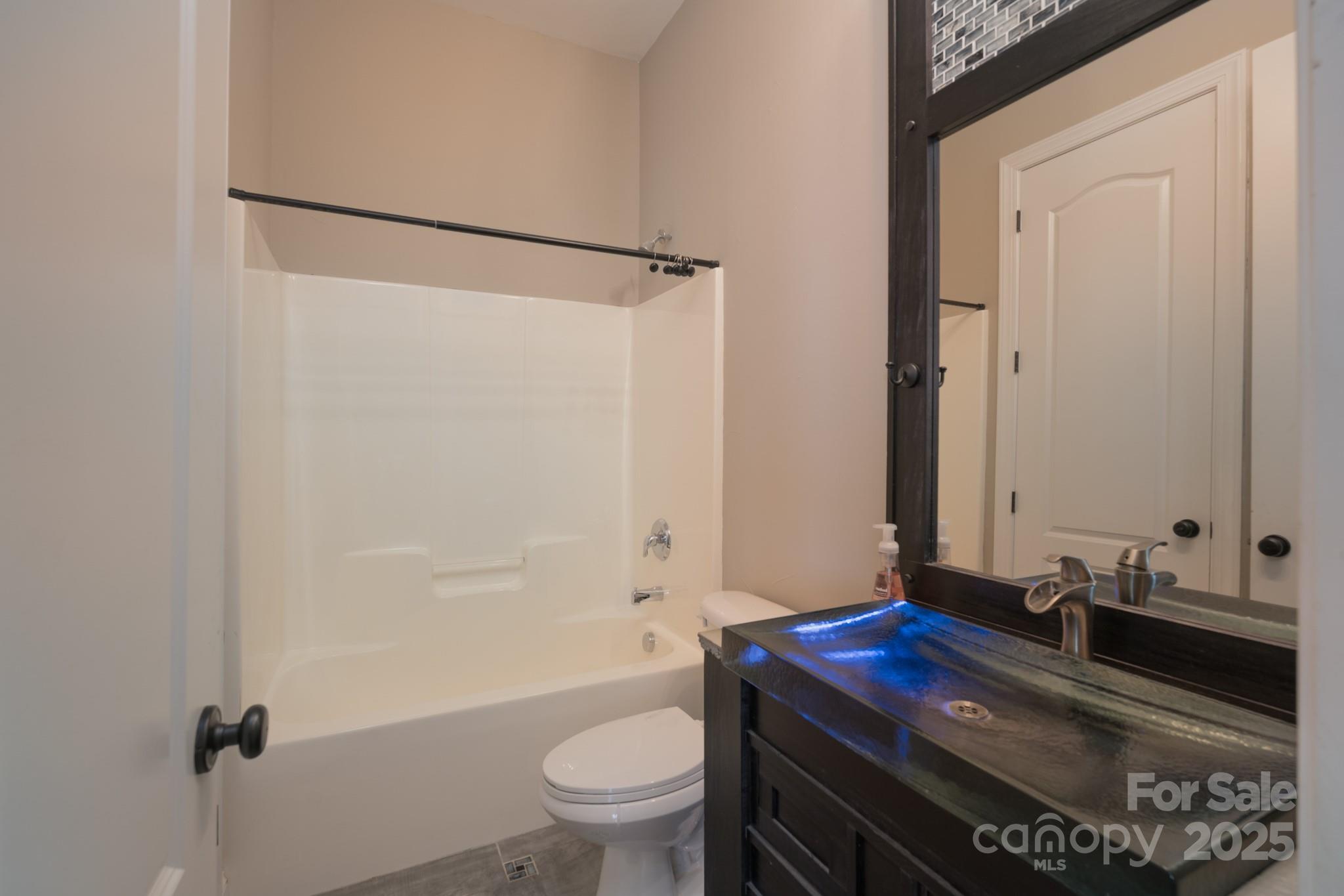 507 Quicksilver Trail Fort Mill, SC 29708 - Photo 17 of 48 a bathroom with a granite countertop sink toilet and shower