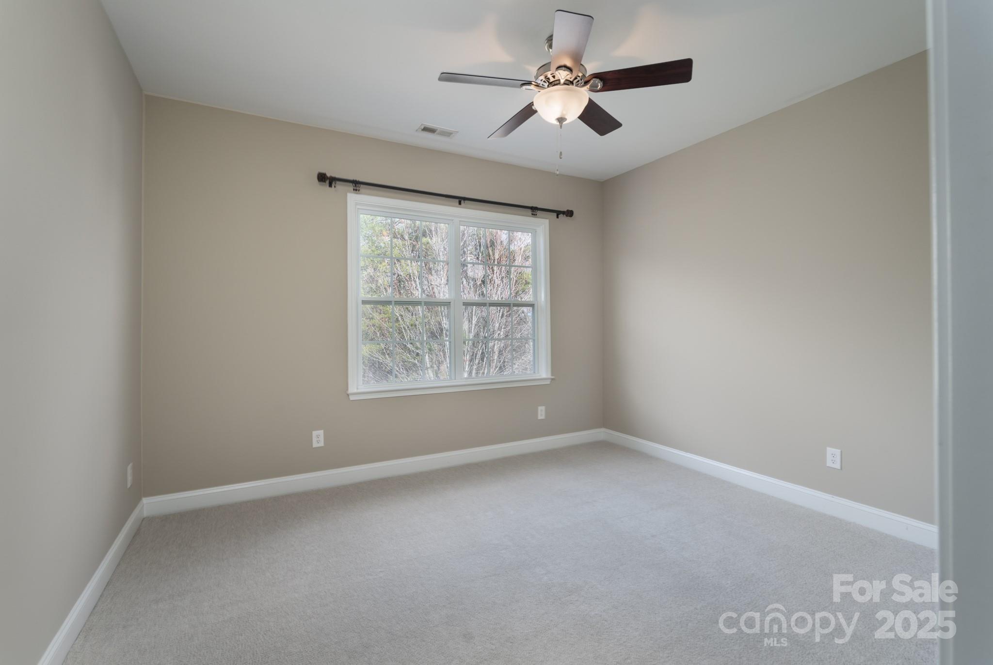507 Quicksilver Trail Fort Mill, SC 29708 - Photo 27 of 48 an empty room with windows and fan