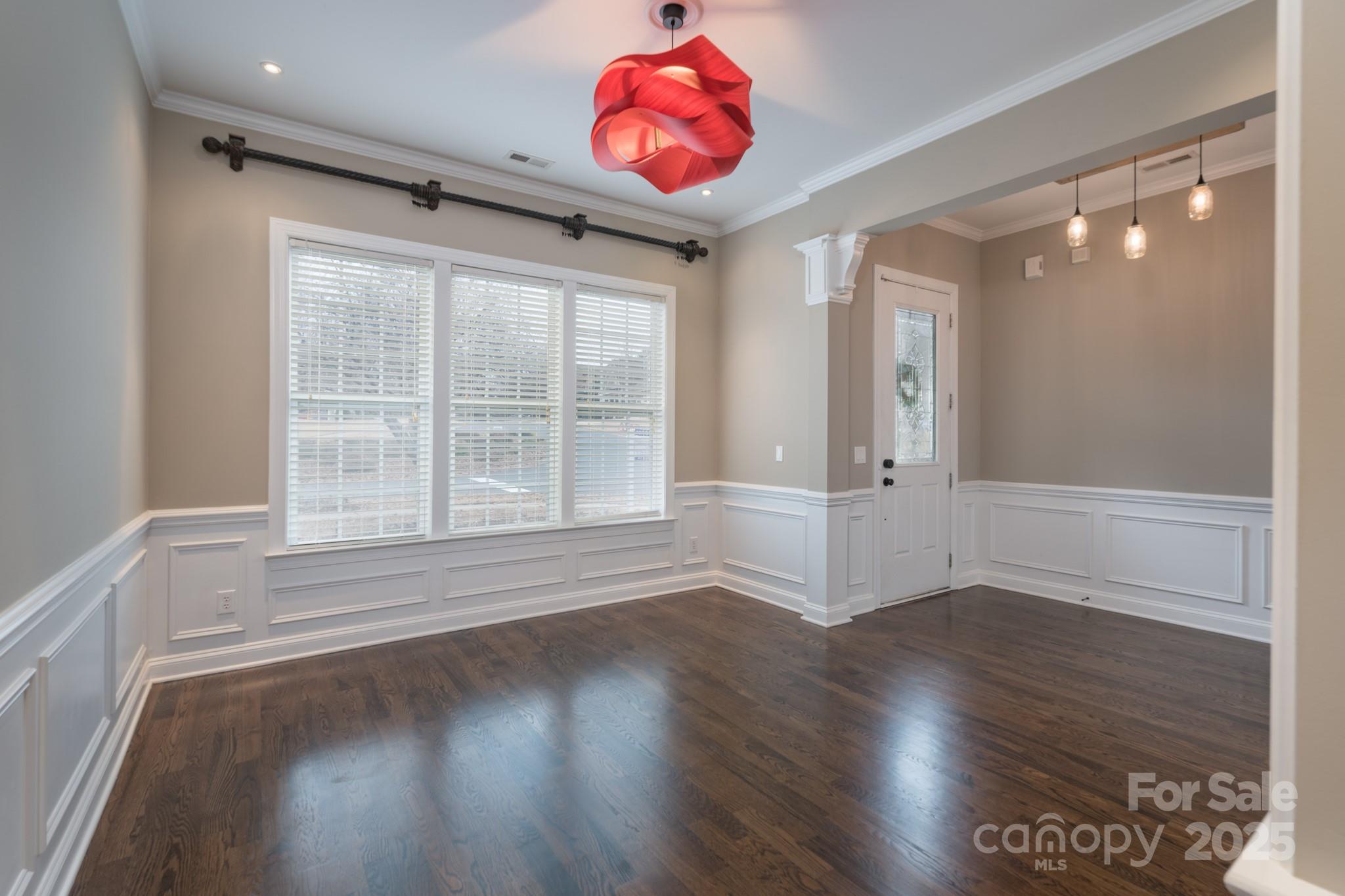 507 Quicksilver Trail Fort Mill, SC 29708 - Photo 3 of 48 a view of an empty room with wooden floor and a window