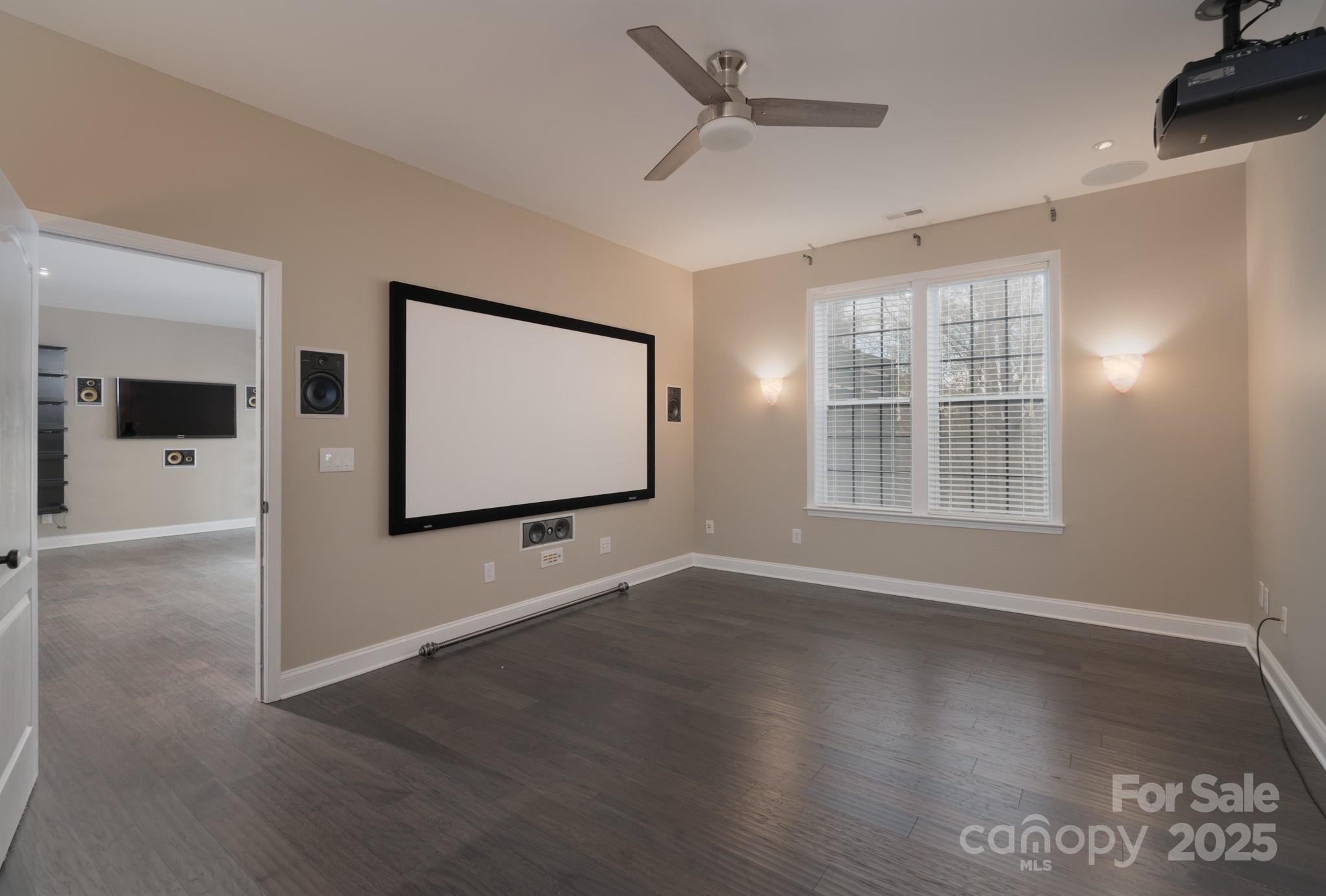 507 Quicksilver Trail Fort Mill, SC 29708 - Photo 36 of 48 a view of an empty room with wooden floor and windows