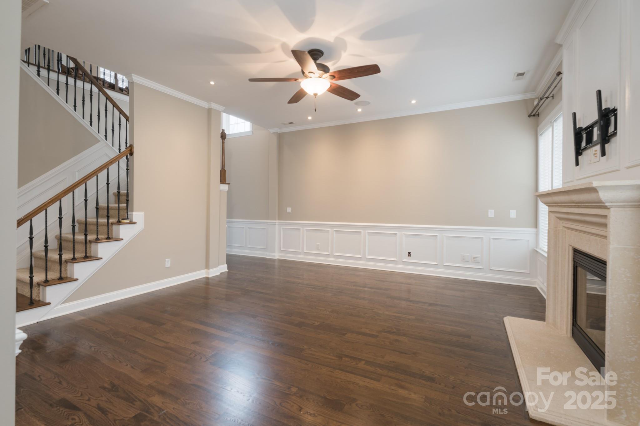 507 Quicksilver Trail Fort Mill, SC 29708 - Photo 7 of 48 a view of an empty room with wooden floor and a fireplace