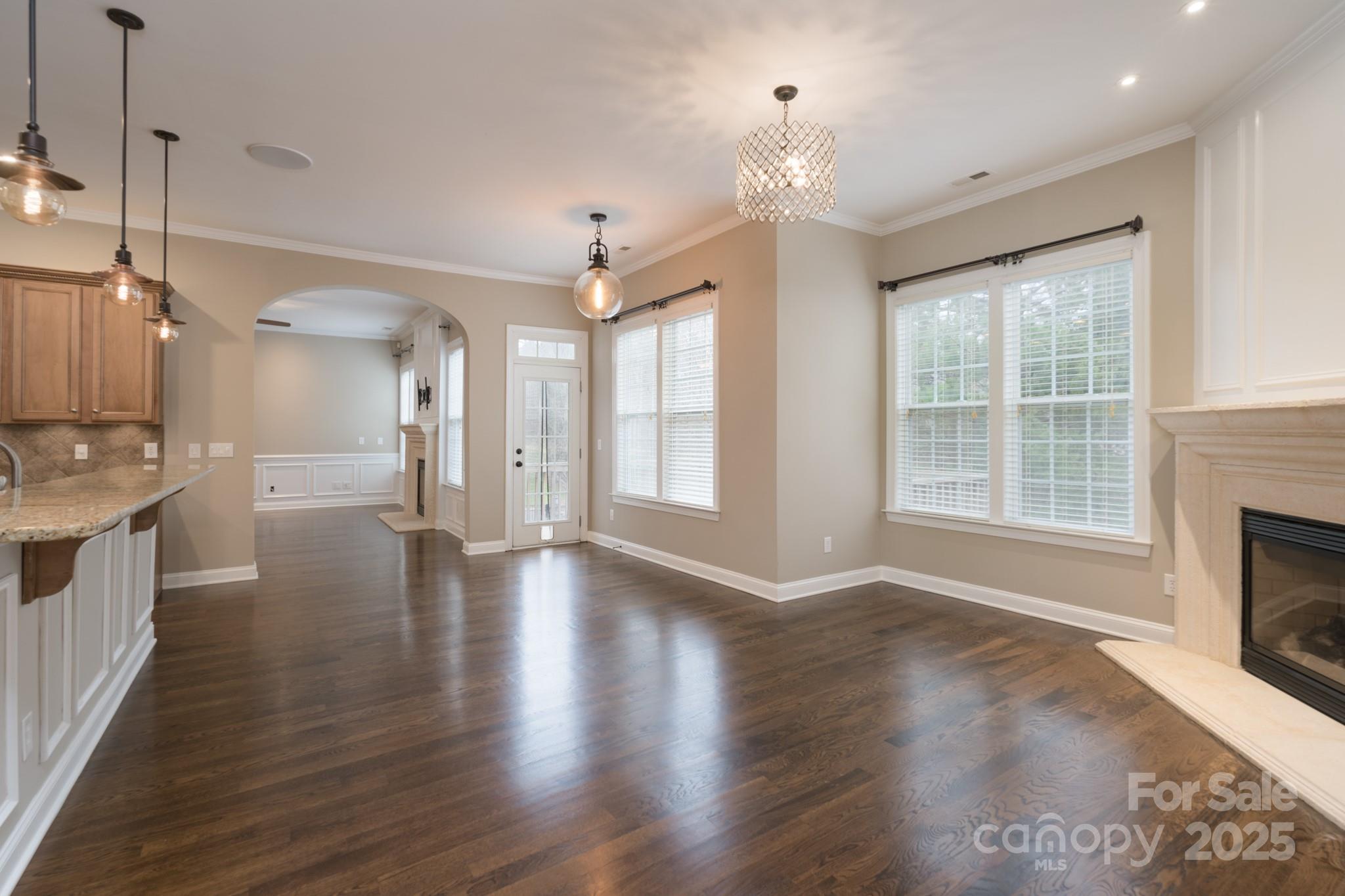 507 Quicksilver Trail Fort Mill, SC 29708 - Photo 10 of 48 a view of a big room with wooden floor and a kitchen