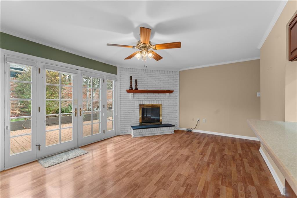 1033 Rutledge Drive Pittsburgh, PA 15241 - Photo 13 of 32 a view of empty room with fireplace and wooden floor