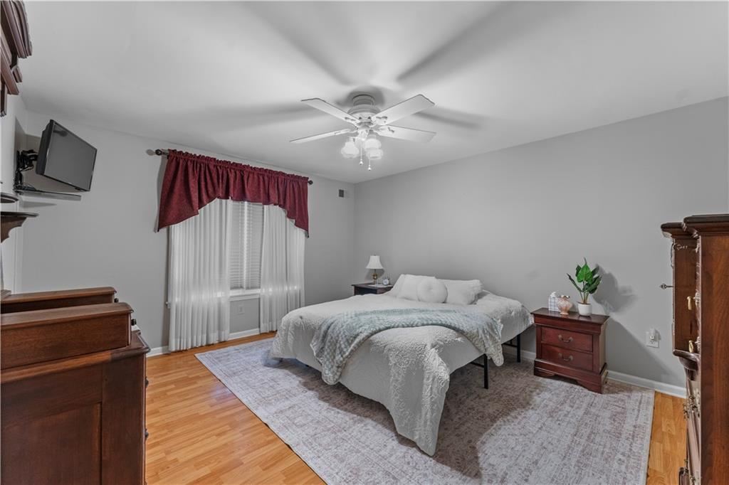 1033 Rutledge Drive Pittsburgh, PA 15241 - Photo 15 of 32 a bedroom with a bed and a chandelier
