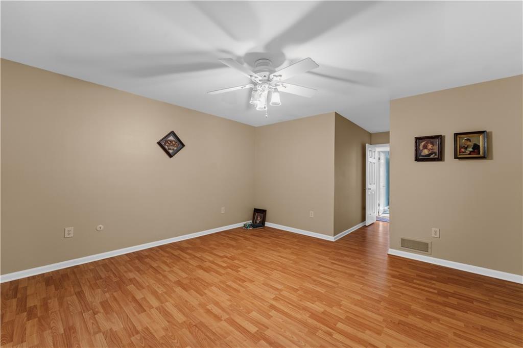 1033 Rutledge Drive Pittsburgh, PA 15241 - Photo 19 of 32 wooden floor in an empty room with a window