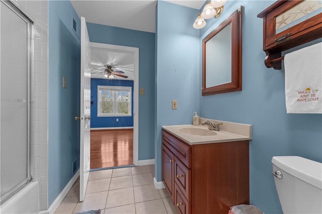 1033 Rutledge Drive Pittsburgh, PA 15241 - Photo 20 of 32 a bathroom with a sink a toilet and mirror