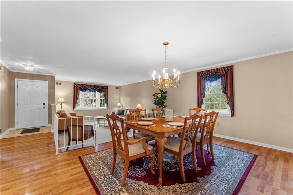 1033 Rutledge Drive Pittsburgh, PA 15241 - Photo 7 of 32 a view of a dining room with furniture and wooden floor