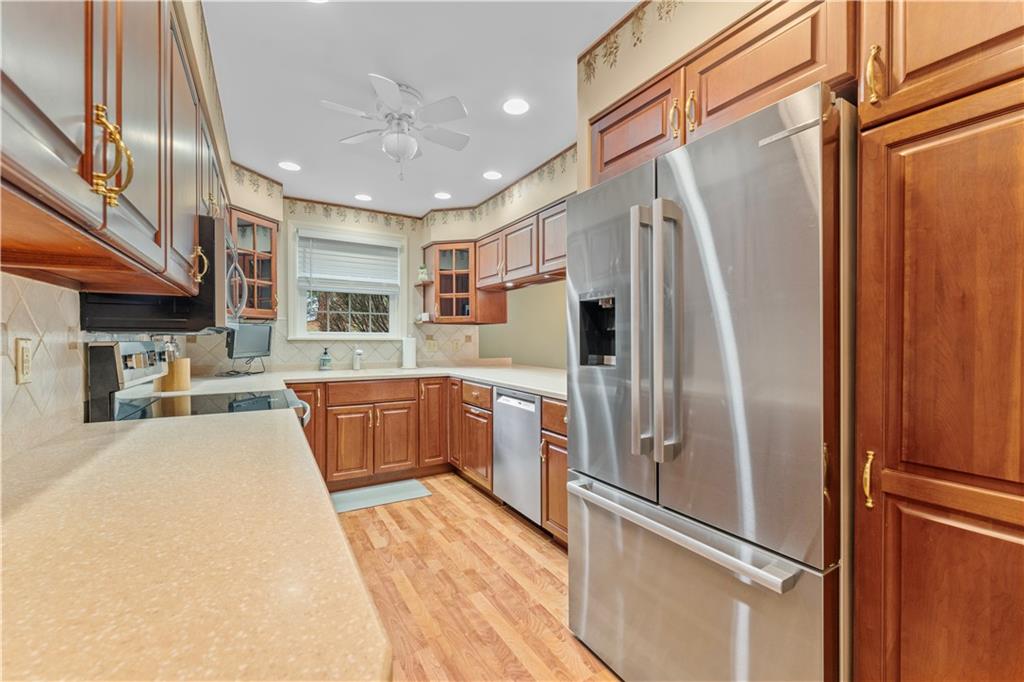 1033 Rutledge Drive Pittsburgh, PA 15241 - Photo 8 of 32 a kitchen with stainless steel appliances granite countertop a refrigerator and a sink