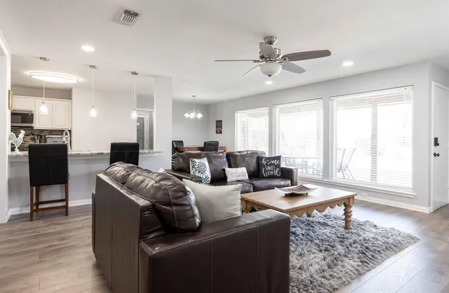 a living room with furniture and a rug