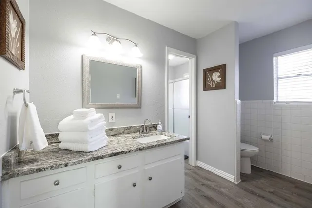 a kitchen with stainless steel appliances granite countertop a stove microwave and sink