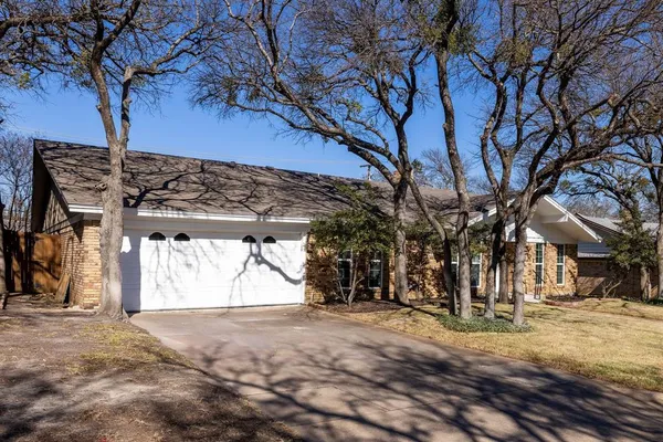 a view of a yard with snow on the road