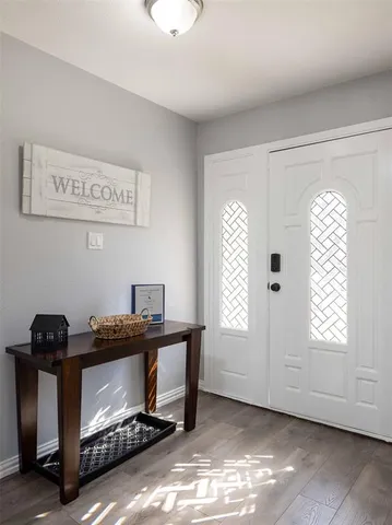 a view of room with window and furniture