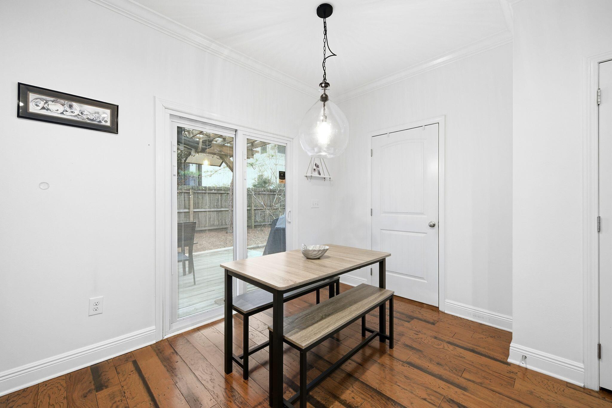 54 West Shore Place Inlet Beach, FL 32461 - Photo 13 of 38 a room with chandelier and wooden floor