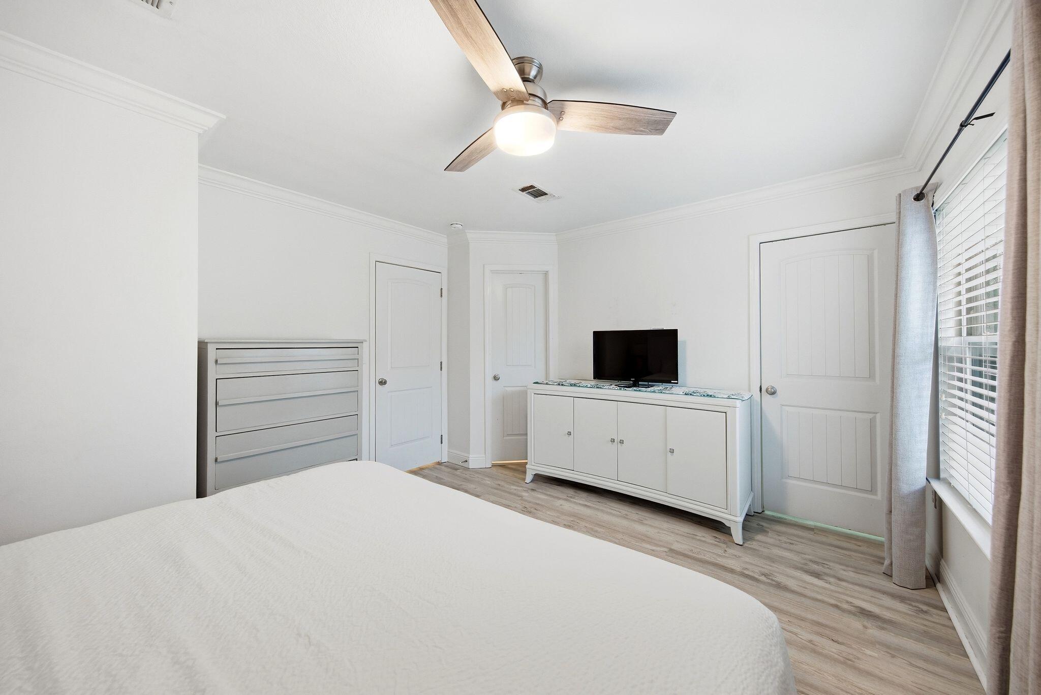 54 West Shore Place Inlet Beach, FL 32461 - Photo 18 of 38 a bedroom with a bed and a flat screen tv